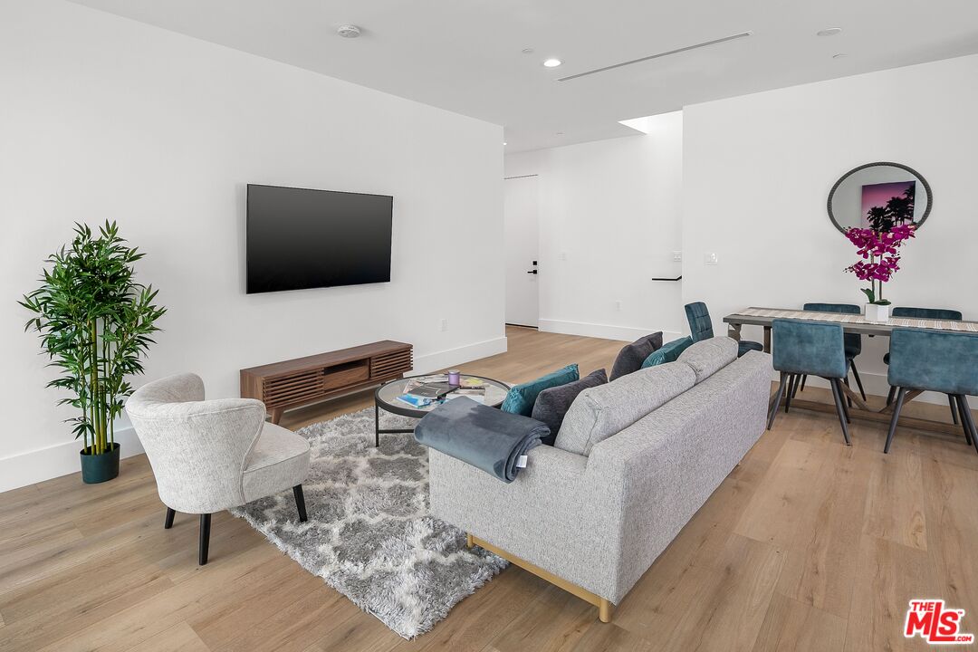 1236 North Spaulding Avenue, Unit 3 West Hollywood, CA 90046 - Photo 9 of 20 a living room with furniture and a flat screen tv