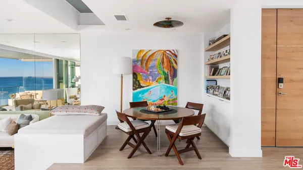 a dining room with furniture and wooden floor