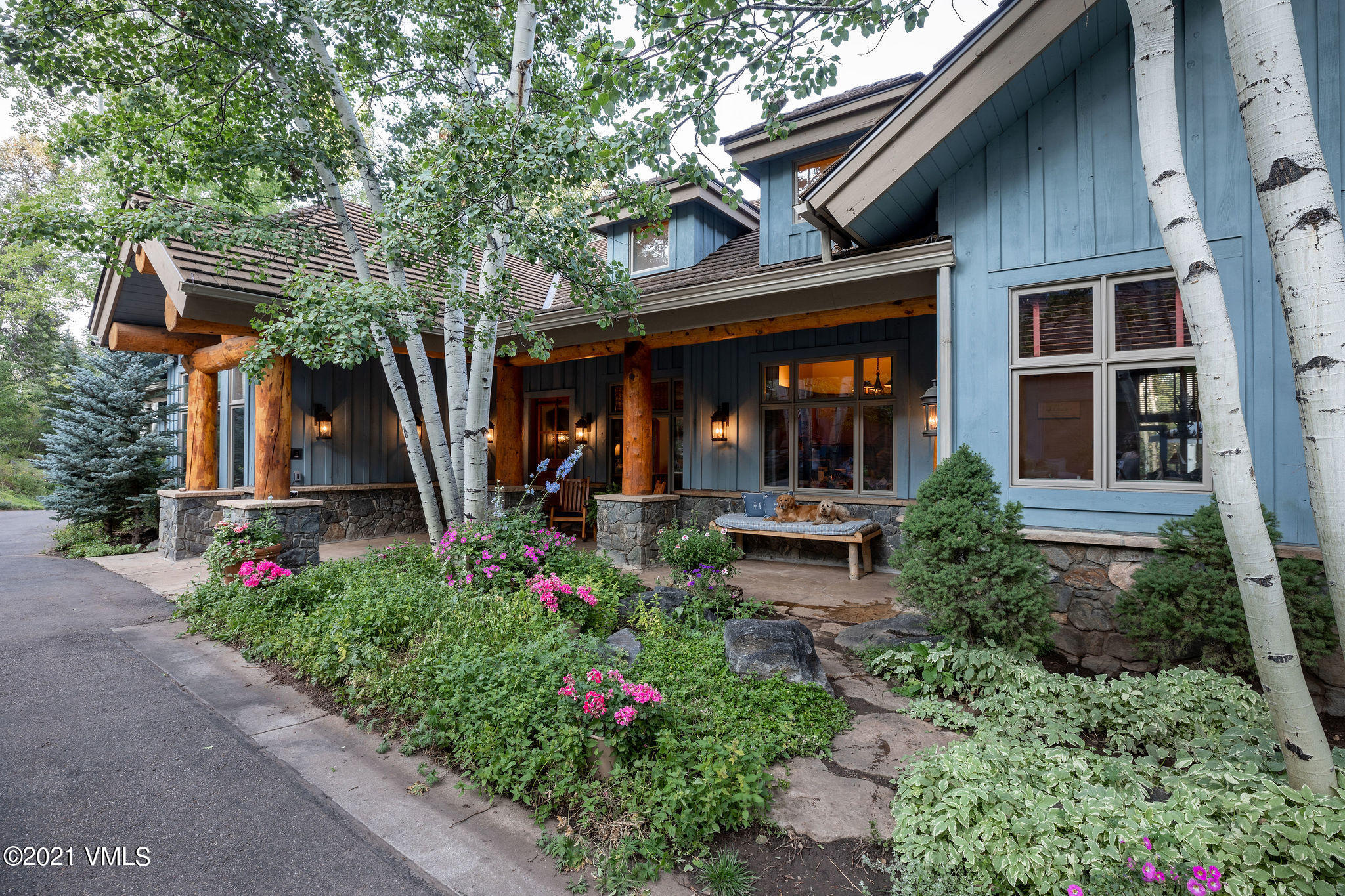 575 Pilgrim Drive Edwards, CO 81632 - Photo 16 of 20 a view of a house with potted plants and a bench