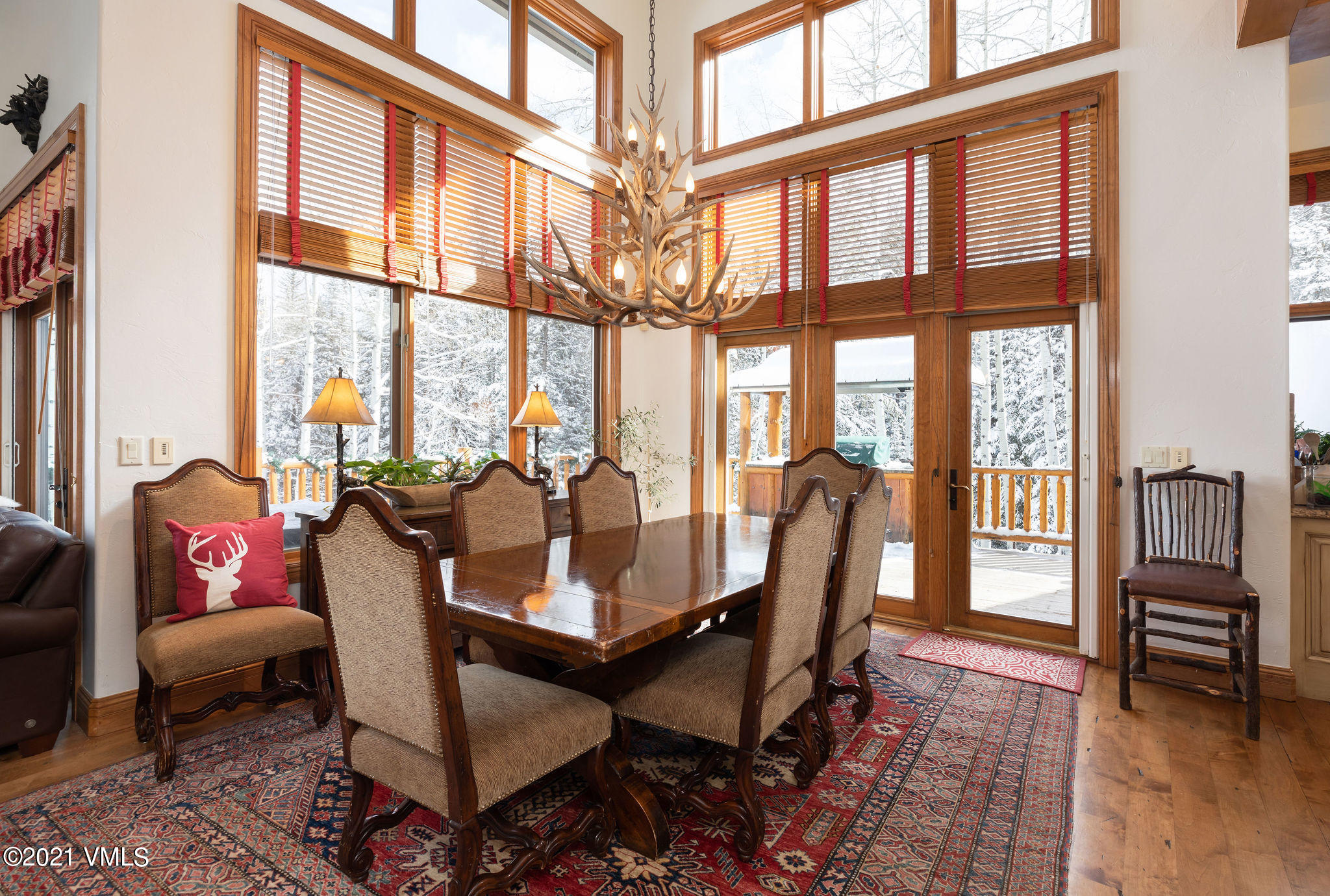 575 Pilgrim Drive Edwards, CO 81632 - Photo 6 of 20 a living room with furniture floor to ceiling windows and wooden floor