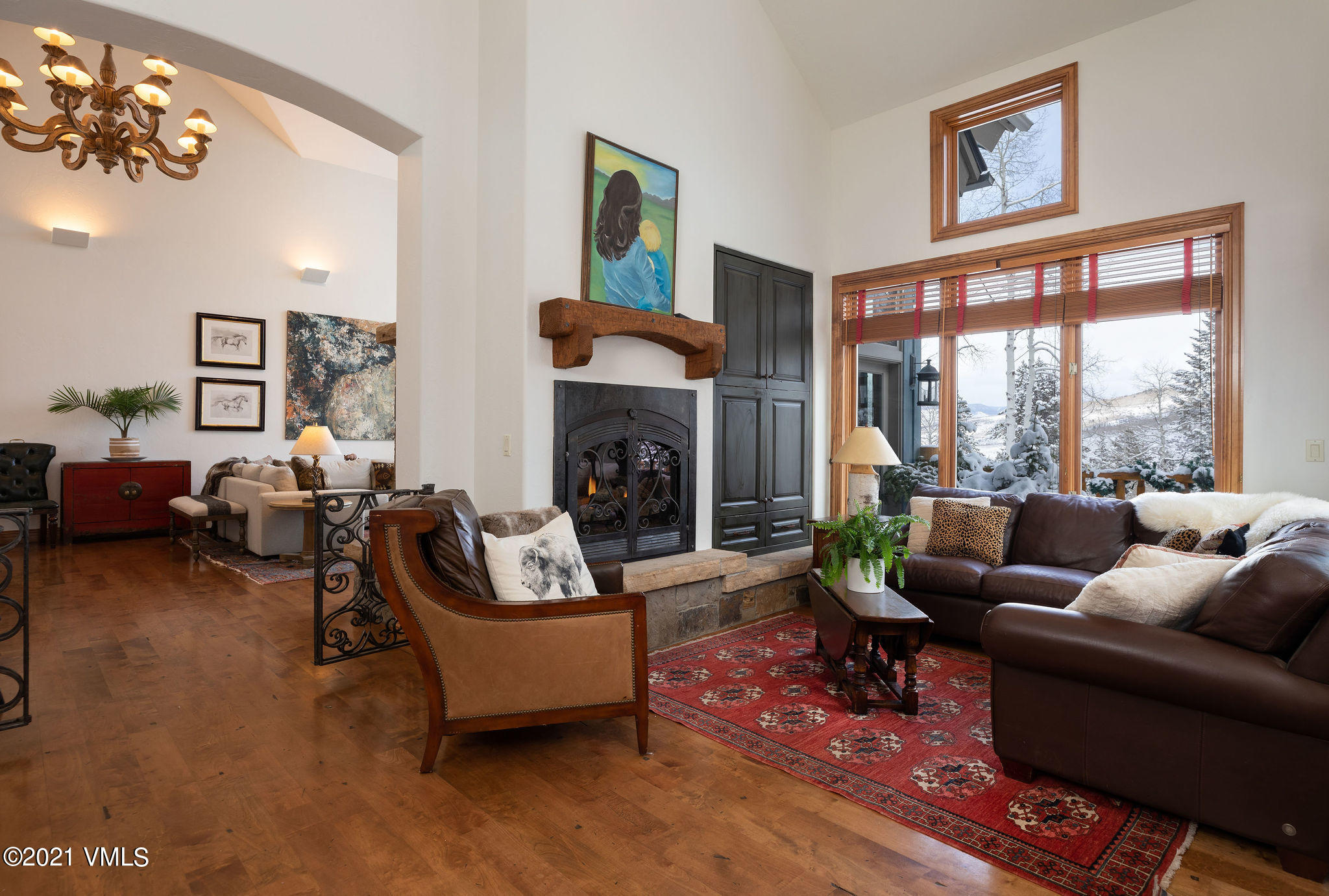 575 Pilgrim Drive Edwards, CO 81632 - Photo 7 of 20 a living room with furniture a fireplace and a large mirror next to a window