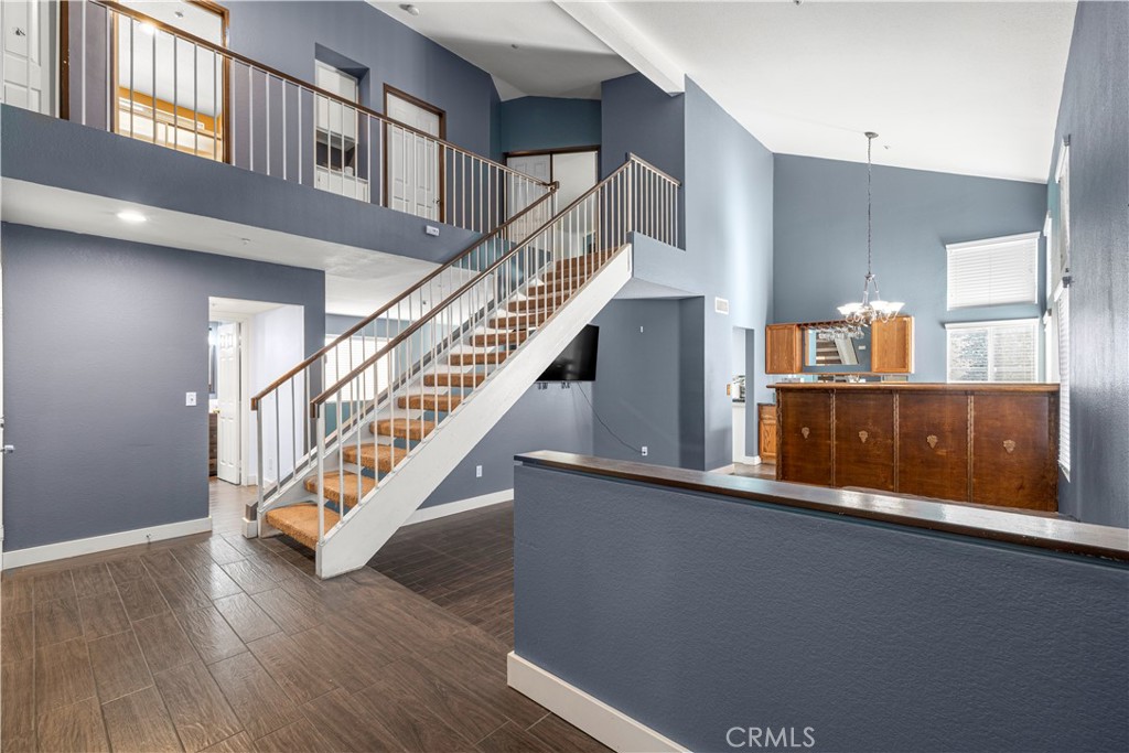 15417 Tobarra Road Fontana, CA 92337 - Photo 4 of 29 a view of entryway and hall with wooden floor
