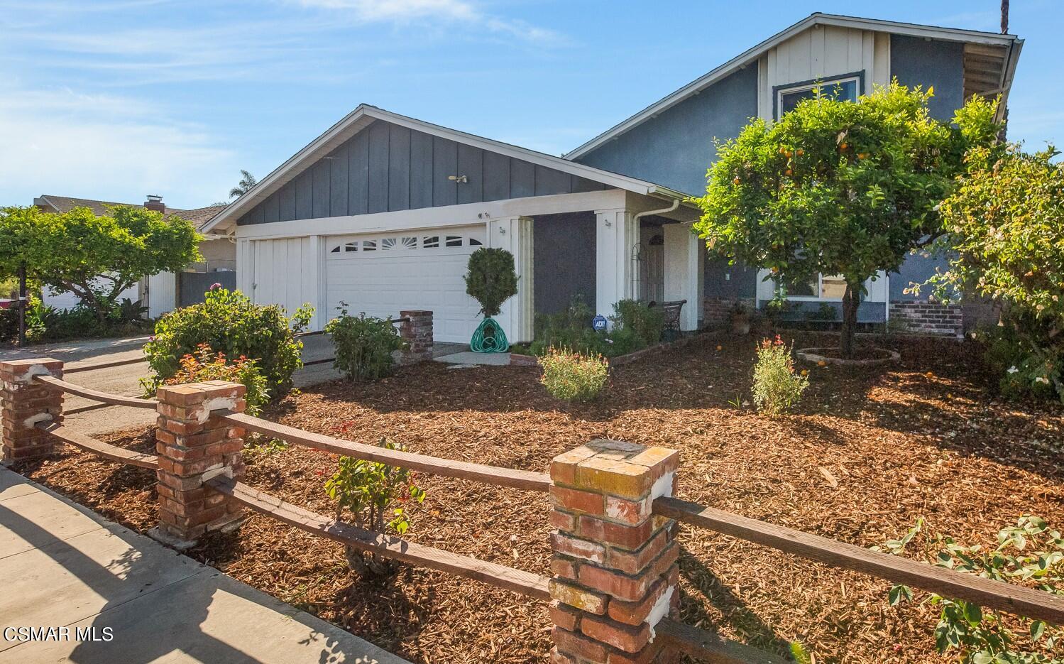 886 Erringer Road Simi Valley, CA 93065 - Photo 1 of 38 a front view of a house with garden