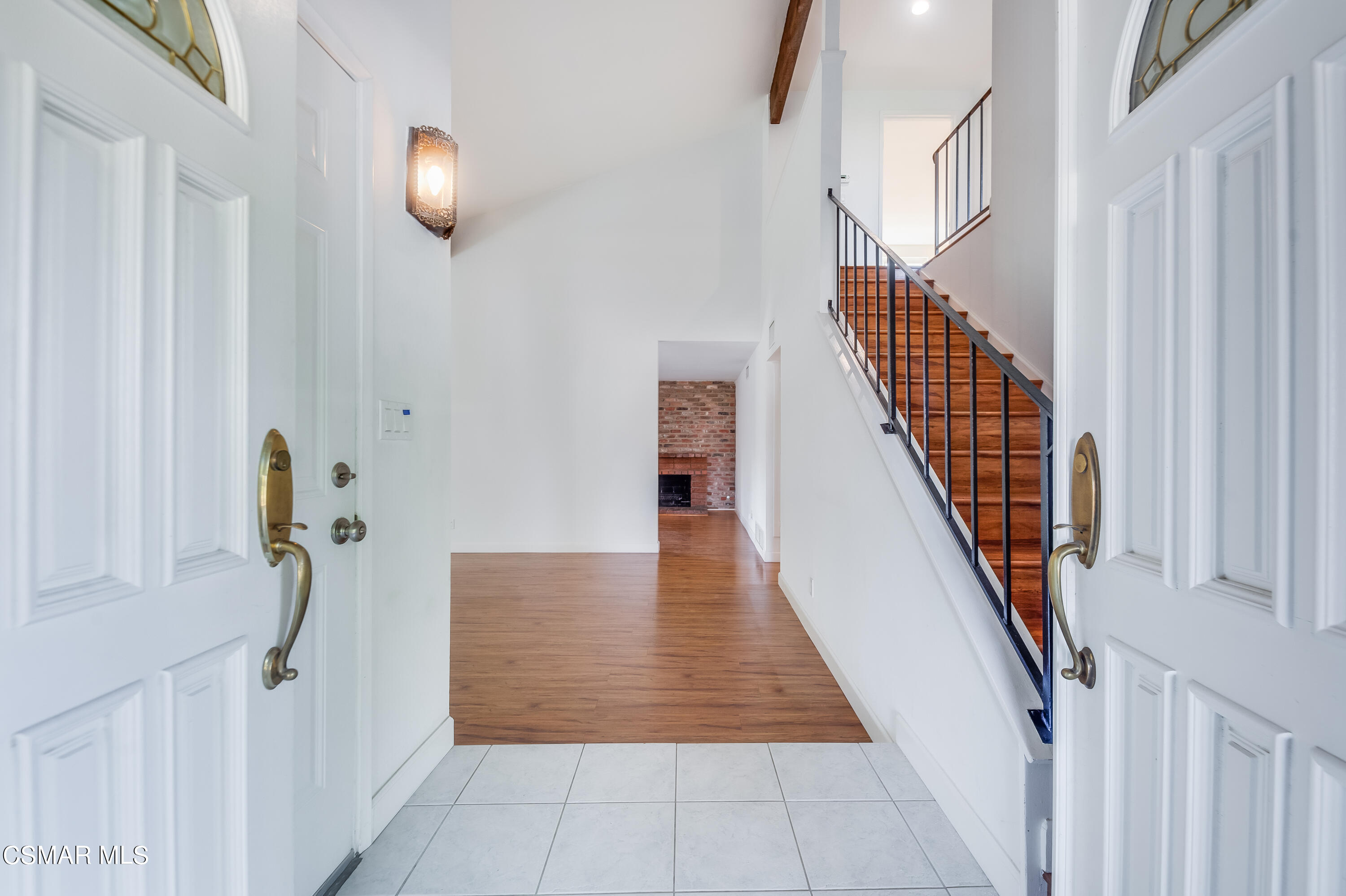 886 Erringer Road Simi Valley, CA 93065 - Photo 3 of 38 a view of a hallway with wooden floor and staircase