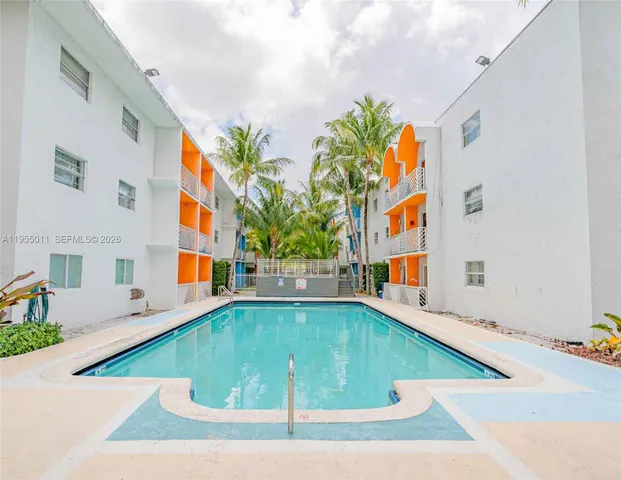 a view of swimming pool with an outdoor seating