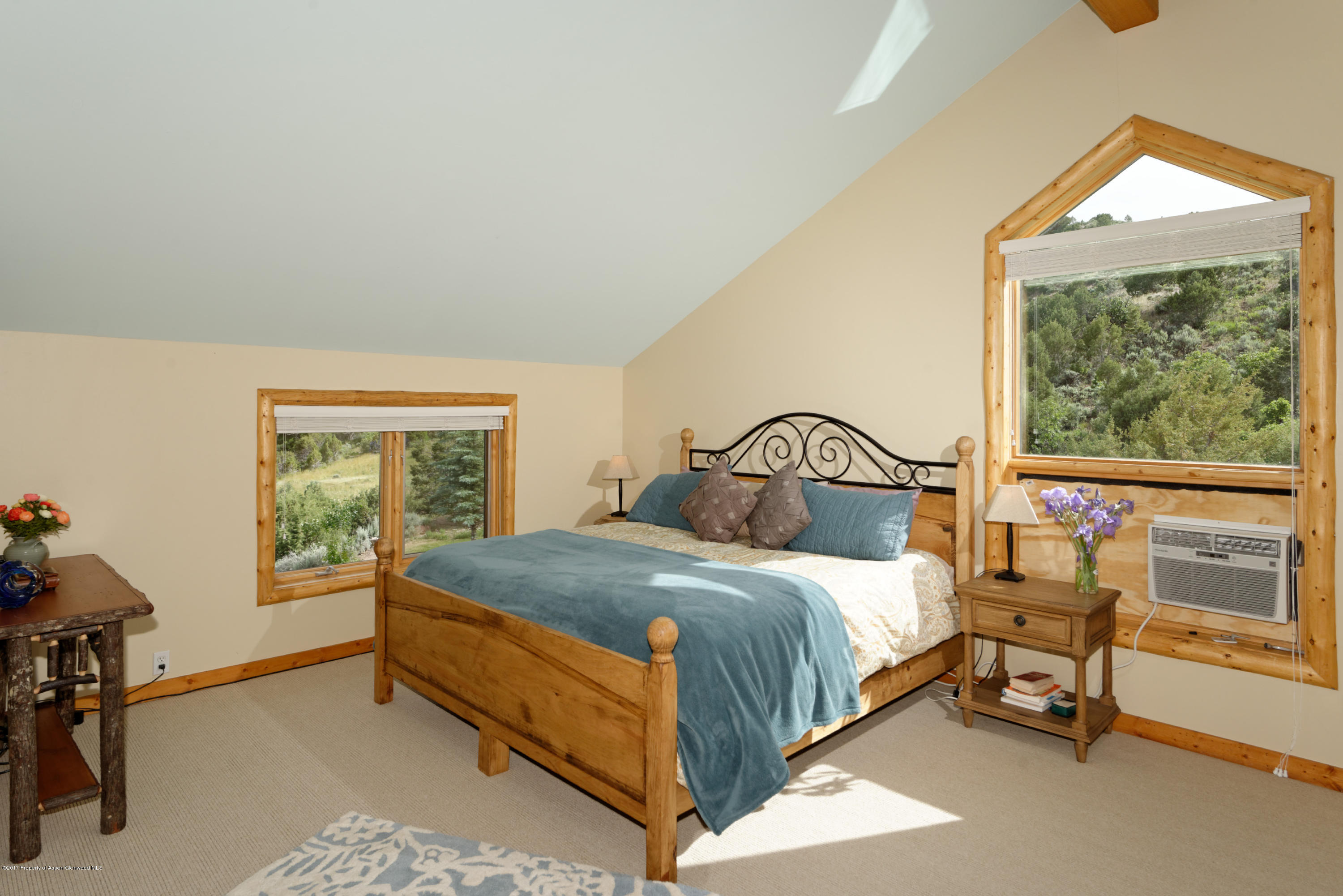 1436 Hooks Spur Road Basalt, CO 81621 - Photo 12 of 21 a bedroom with a bed and a window