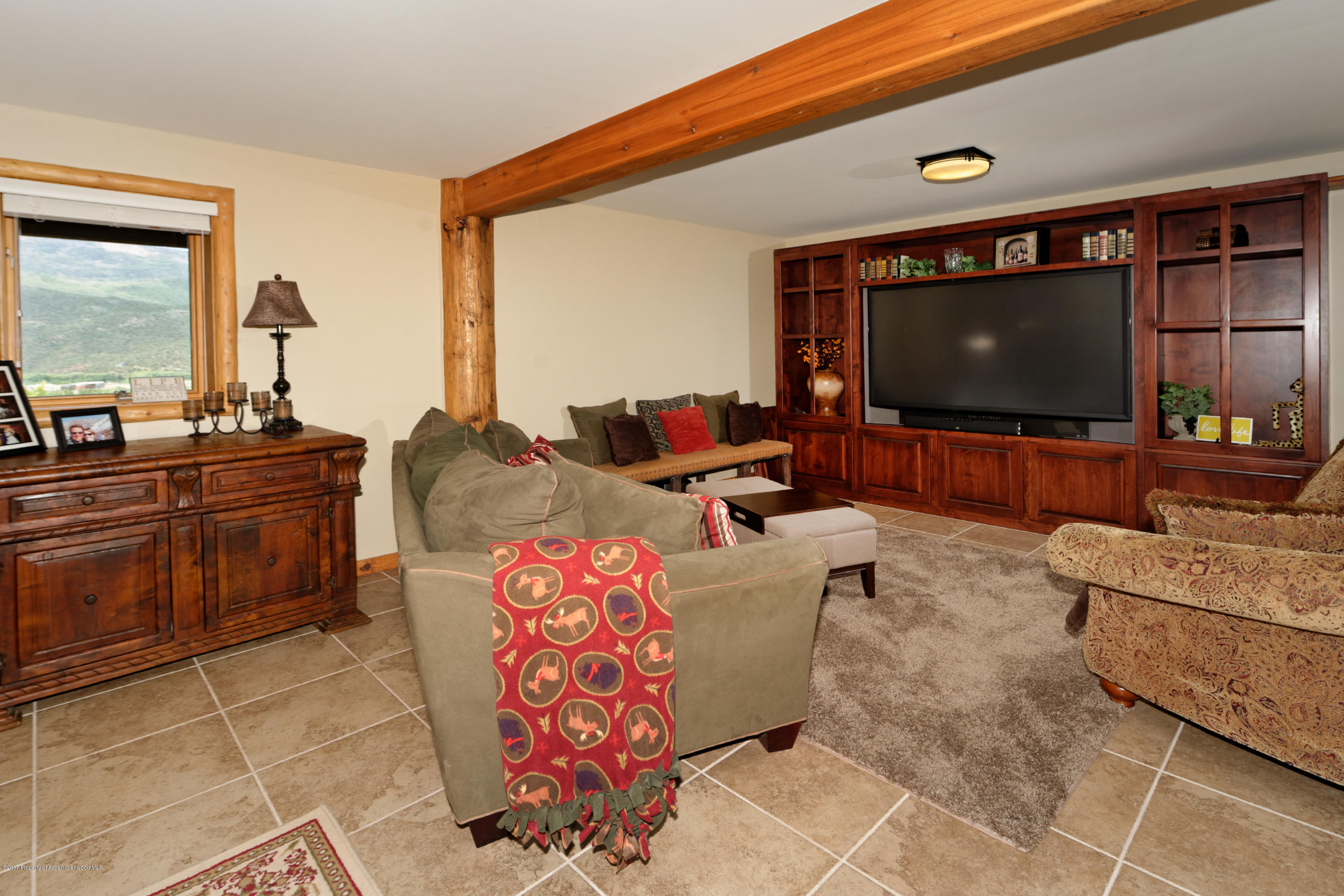 1436 Hooks Spur Road Basalt, CO 81621 - Photo 14 of 21 a living room with furniture and a flat screen tv