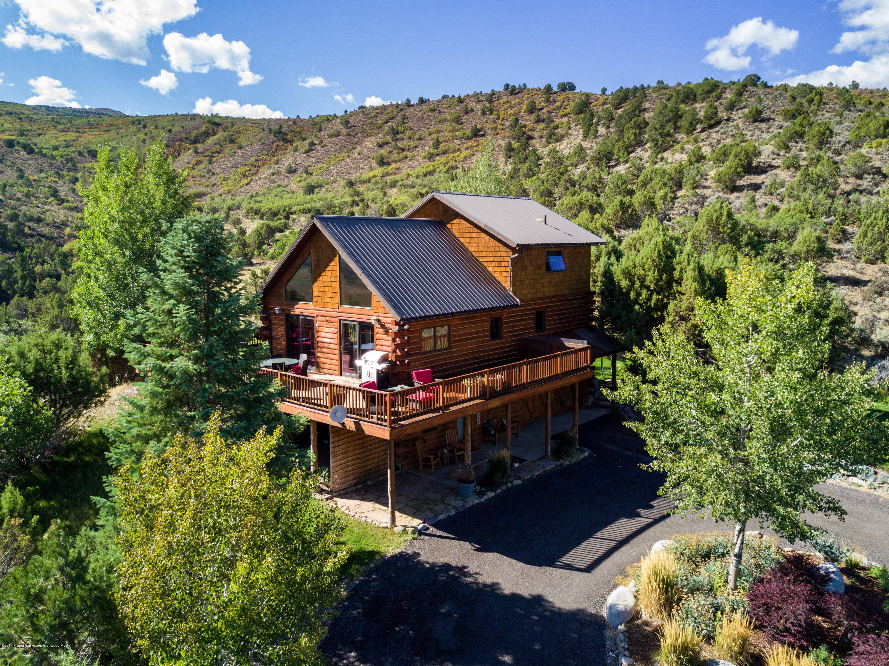 1436 Hooks Spur Road Basalt, CO 81621 - Photo 2 of 21 a view of house with a yard and sitting area