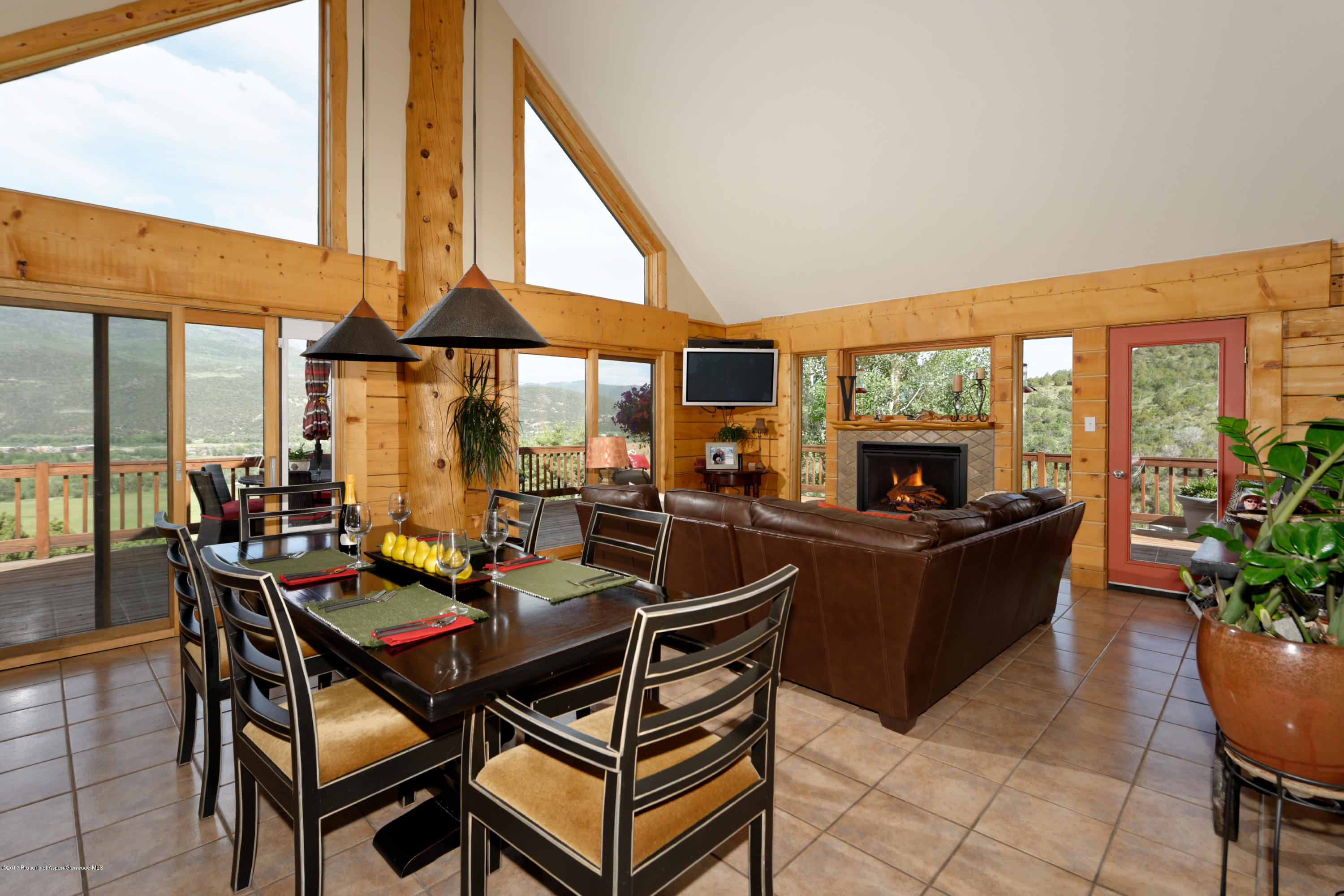 1436 Hooks Spur Road Basalt, CO 81621 - Photo 10 of 21 a dining room with furniture and a floor to ceiling window