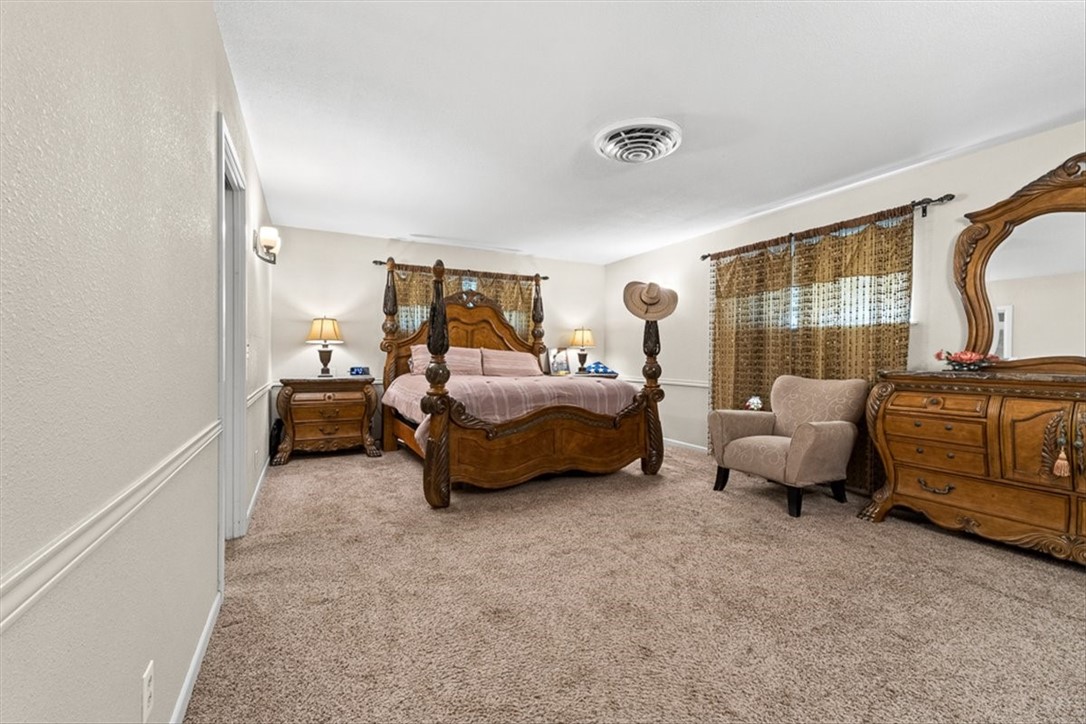 9675 County Road 325 Mathis, TX 78368 - Photo 20 of 29 a bedroom with furniture and a large window