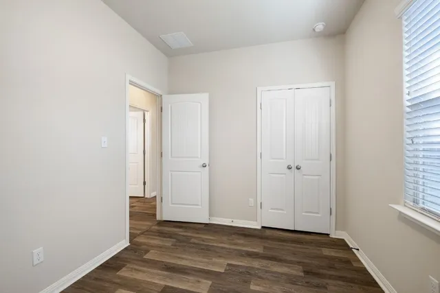 a view of an empty room and window
