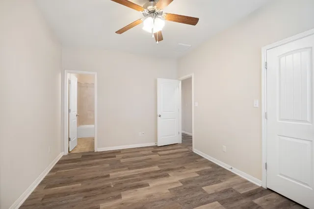 a view of room with window and ceiling fan