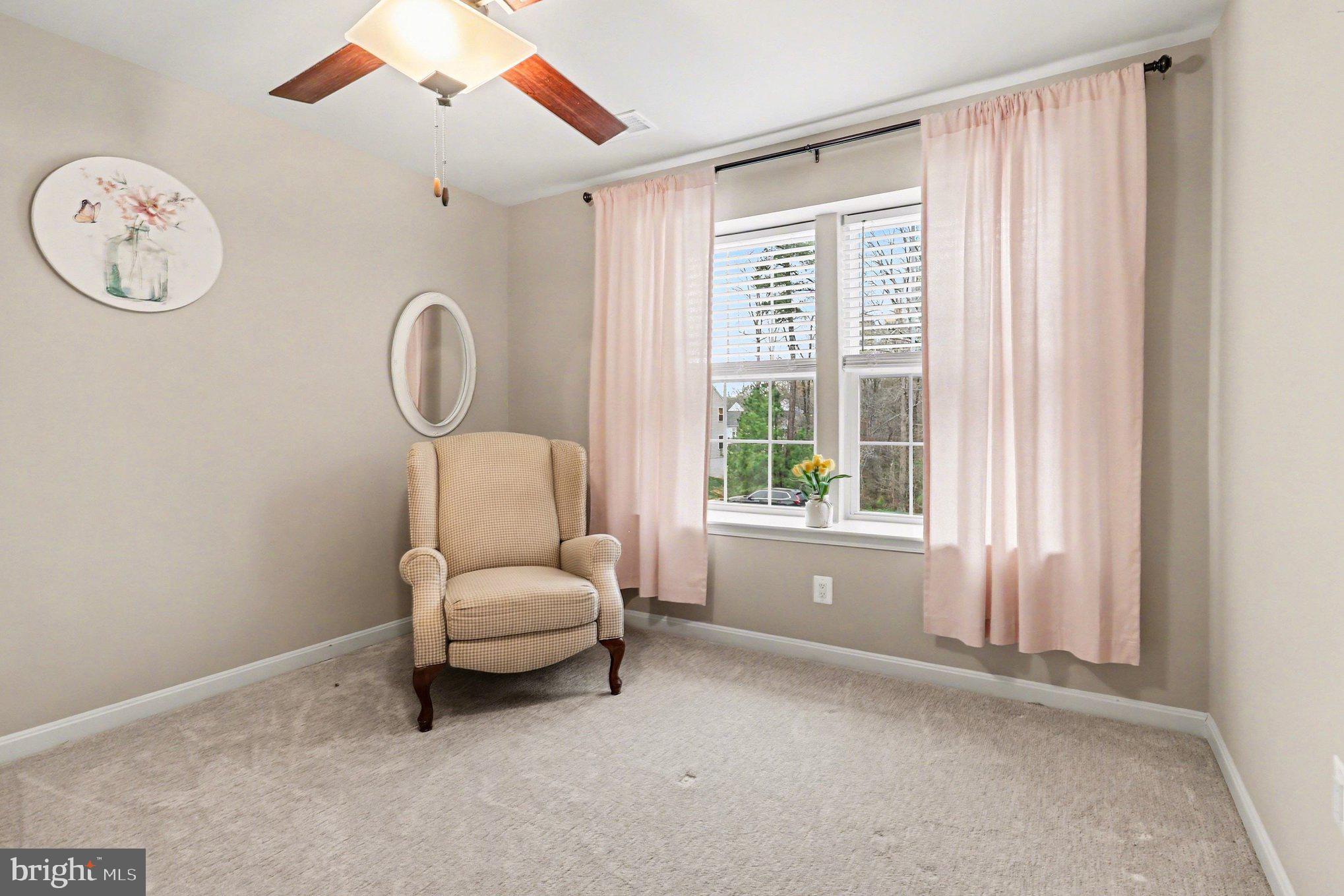 18474 Patriot Lane Ruther Glen, VA 22546 - Photo 16 of 25 a living room with furniture and a large window