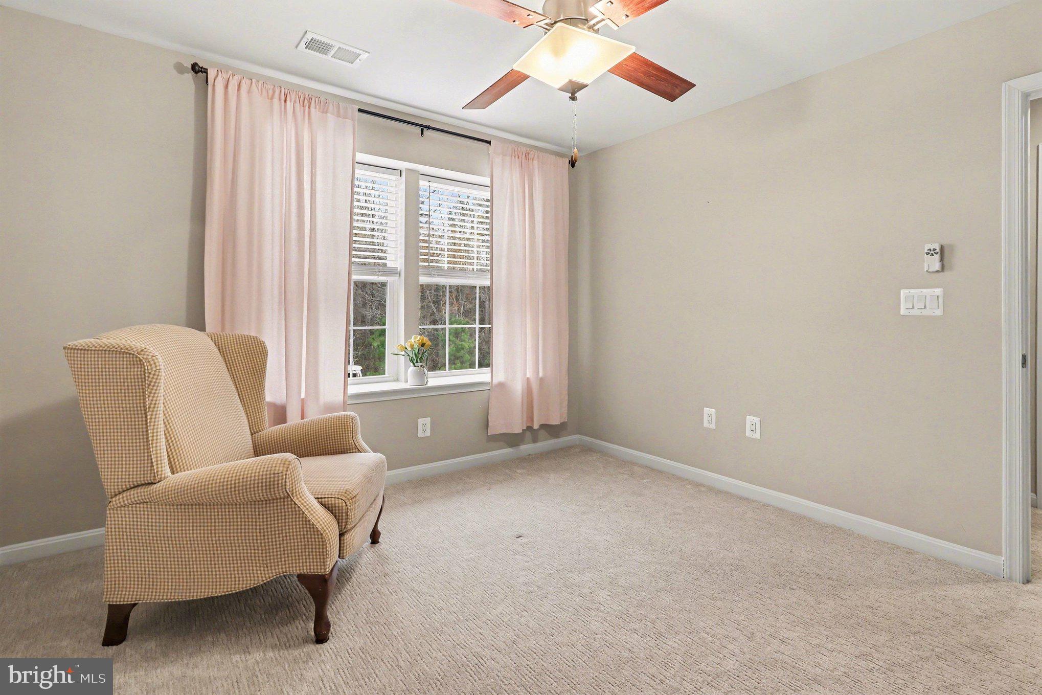 18474 Patriot Lane Ruther Glen, VA 22546 - Photo 17 of 25 a living room with furniture and a large window