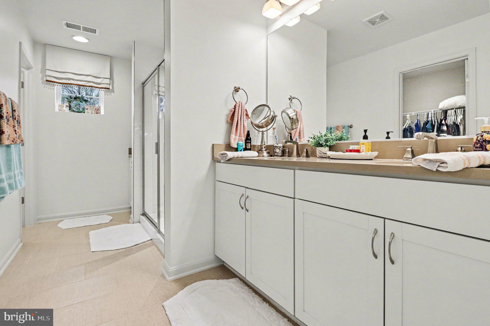 18474 Patriot Lane Ruther Glen, VA 22546 - Photo 19 of 25 a en suite bathroom with a toilet sink and mirror