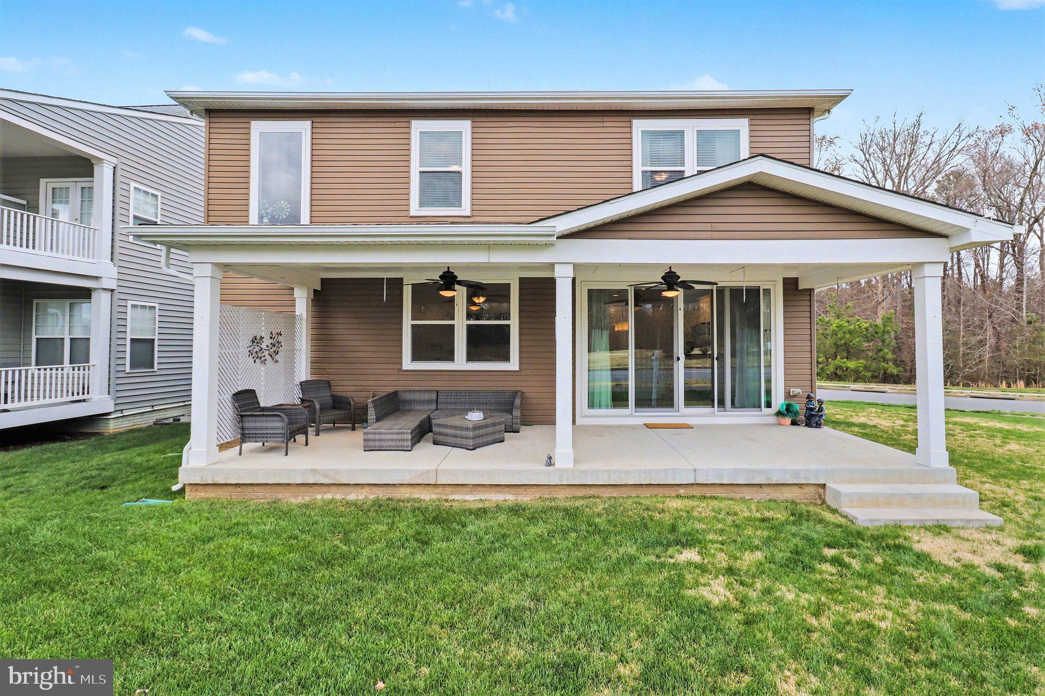 18474 Patriot Lane Ruther Glen, VA 22546 - Photo 25 of 25 a front view of a house with a garden and patio