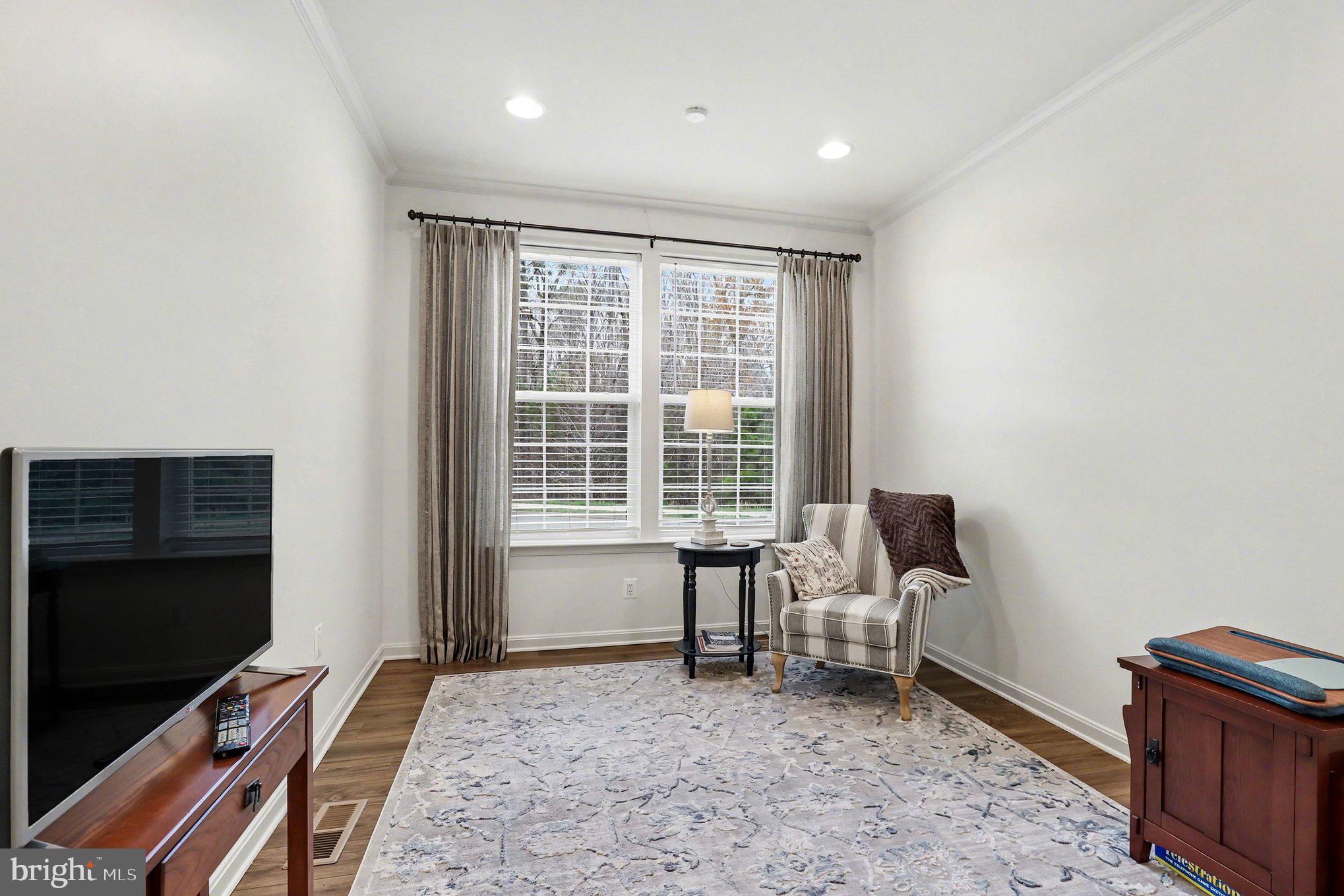 18474 Patriot Lane Ruther Glen, VA 22546 - Photo 4 of 25 a living room with furniture rug and a flat screen tv