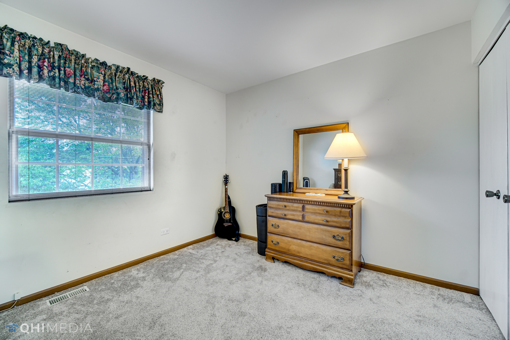 261 Ascot Lane Streamwood, IL 60107 - Photo 19 of 23 a bedroom with a bed and a dresser