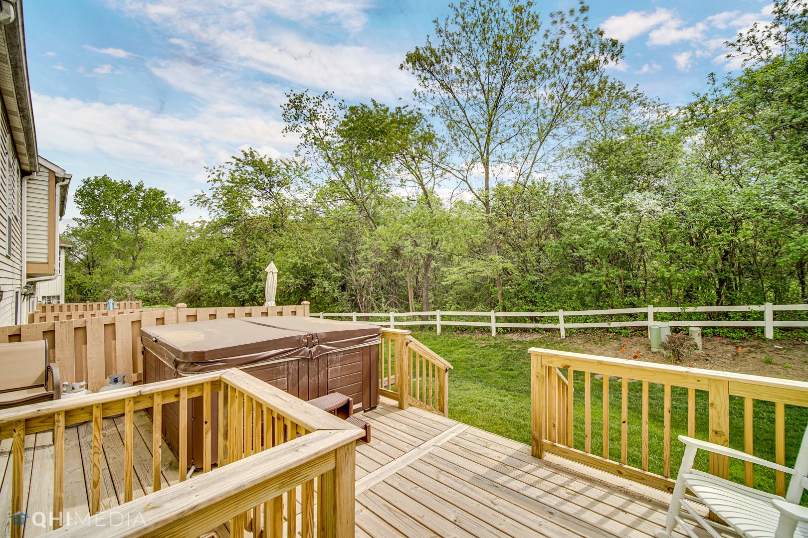 261 Ascot Lane Streamwood, IL 60107 - Photo 21 of 23 a view of a roof deck with couches and wooden fence