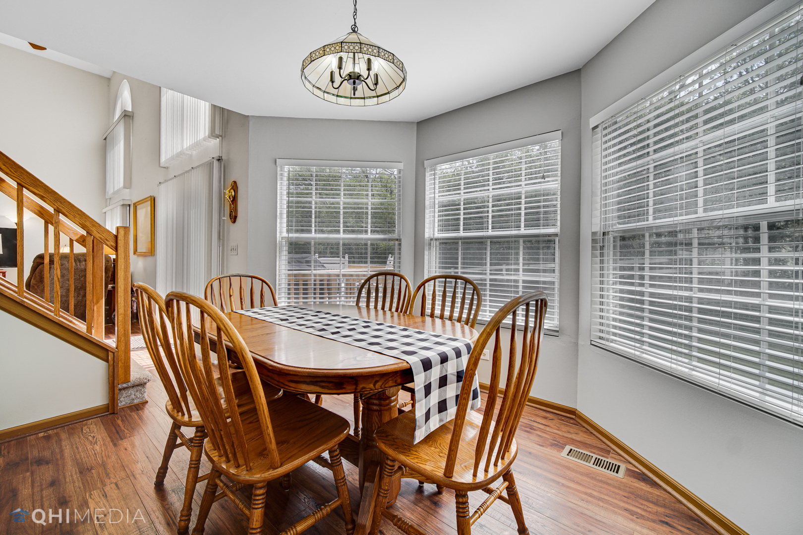 261 Ascot Lane Streamwood, IL 60107 - Photo 7 of 23 a view of a dining room with furniture window and wooden floor