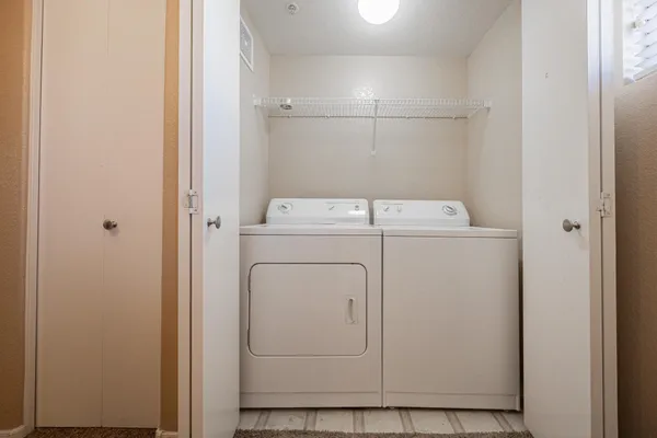a utility room with dryer and washer