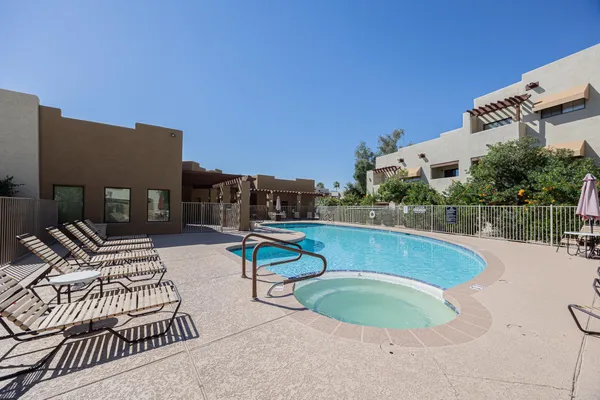 a view of a swimming pool with a patio