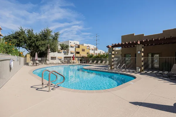 swimming pool view with a outdoor seating space