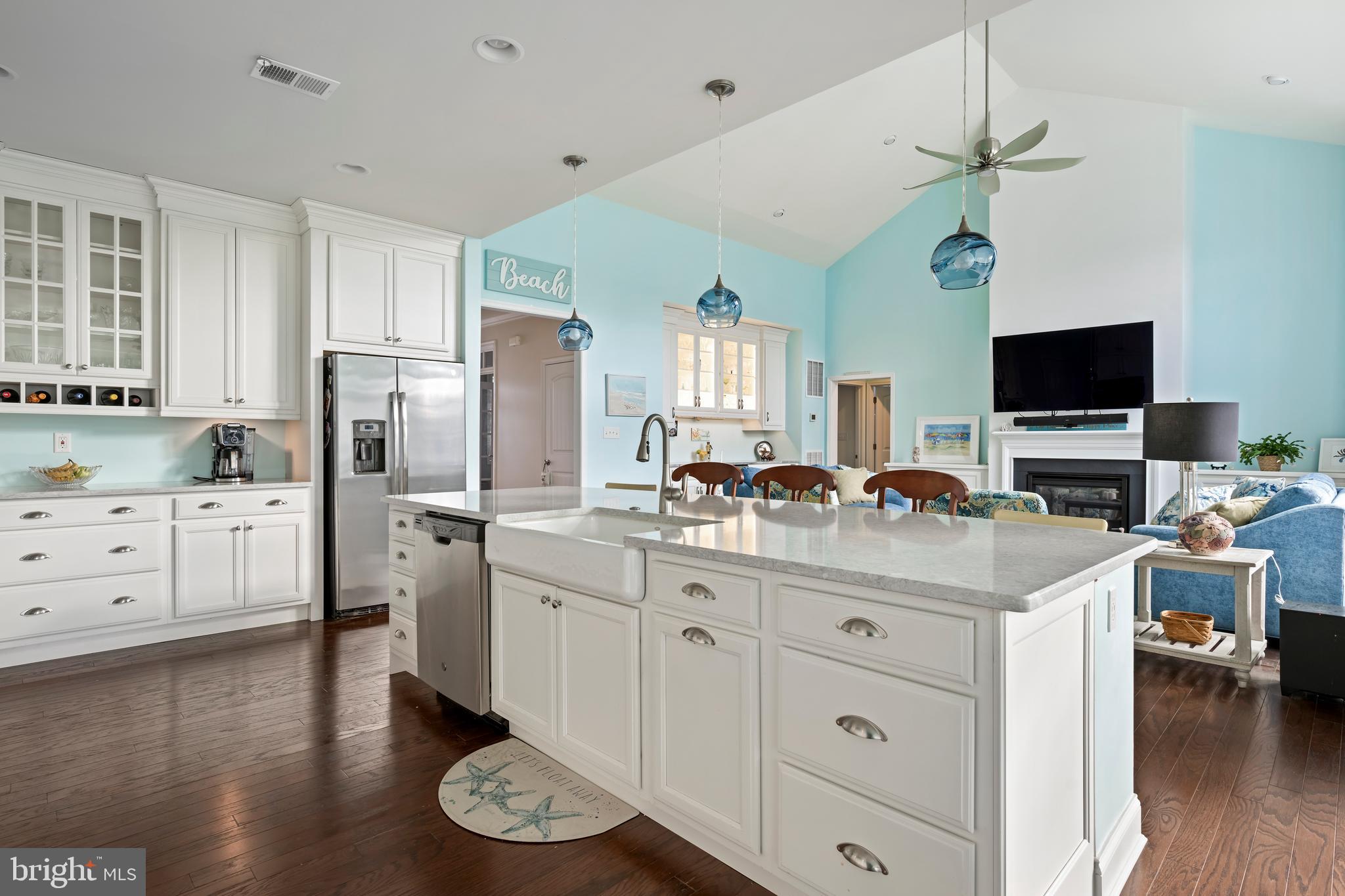 34017 Smiths Point Lane Lewes, DE 19958 - Photo 66 of 66 a kitchen with stainless steel appliances a stove refrigerator sink and wooden floor