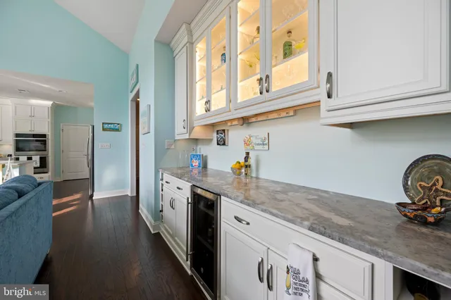 a large kitchen with a table and chairs