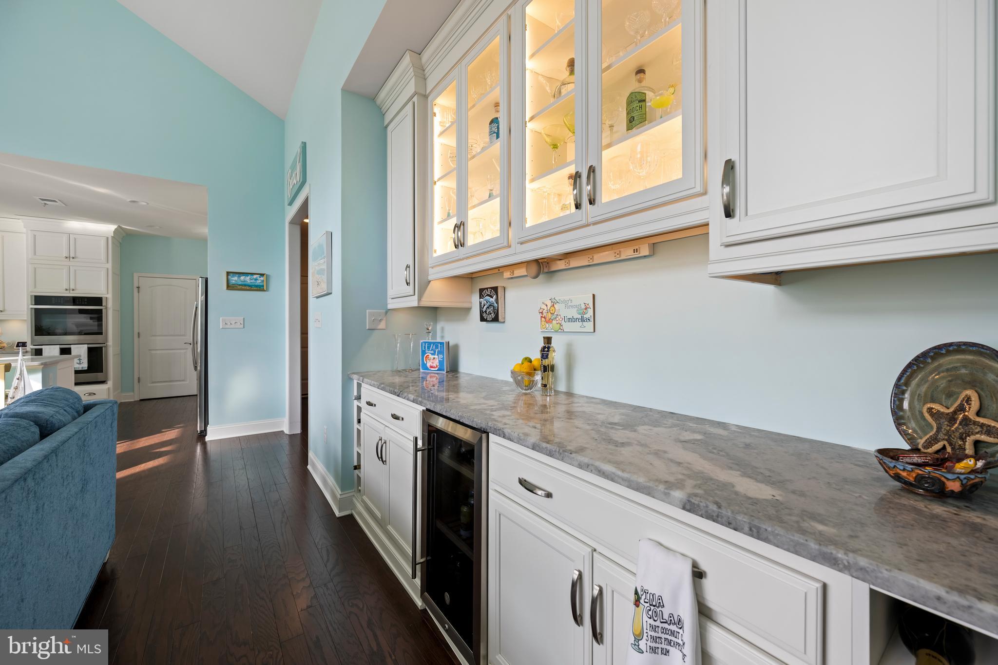 34017 Smiths Point Lane Lewes, DE 19958 - Photo 14 of 66 a kitchen with stainless steel appliances granite countertop a sink a stove and cabinets