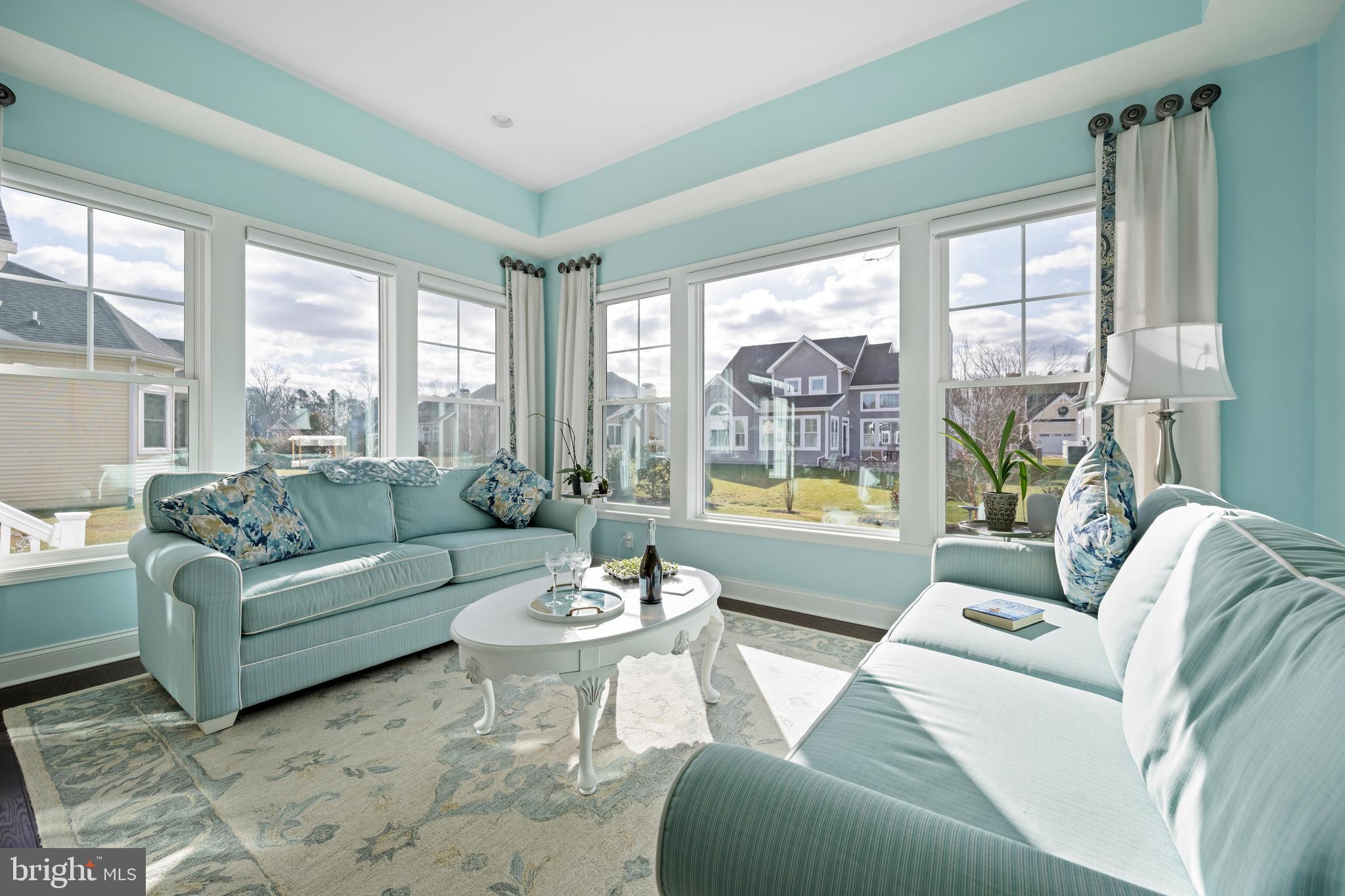 34017 Smiths Point Lane Lewes, DE 19958 - Photo 19 of 66 a living room with furniture and a large window