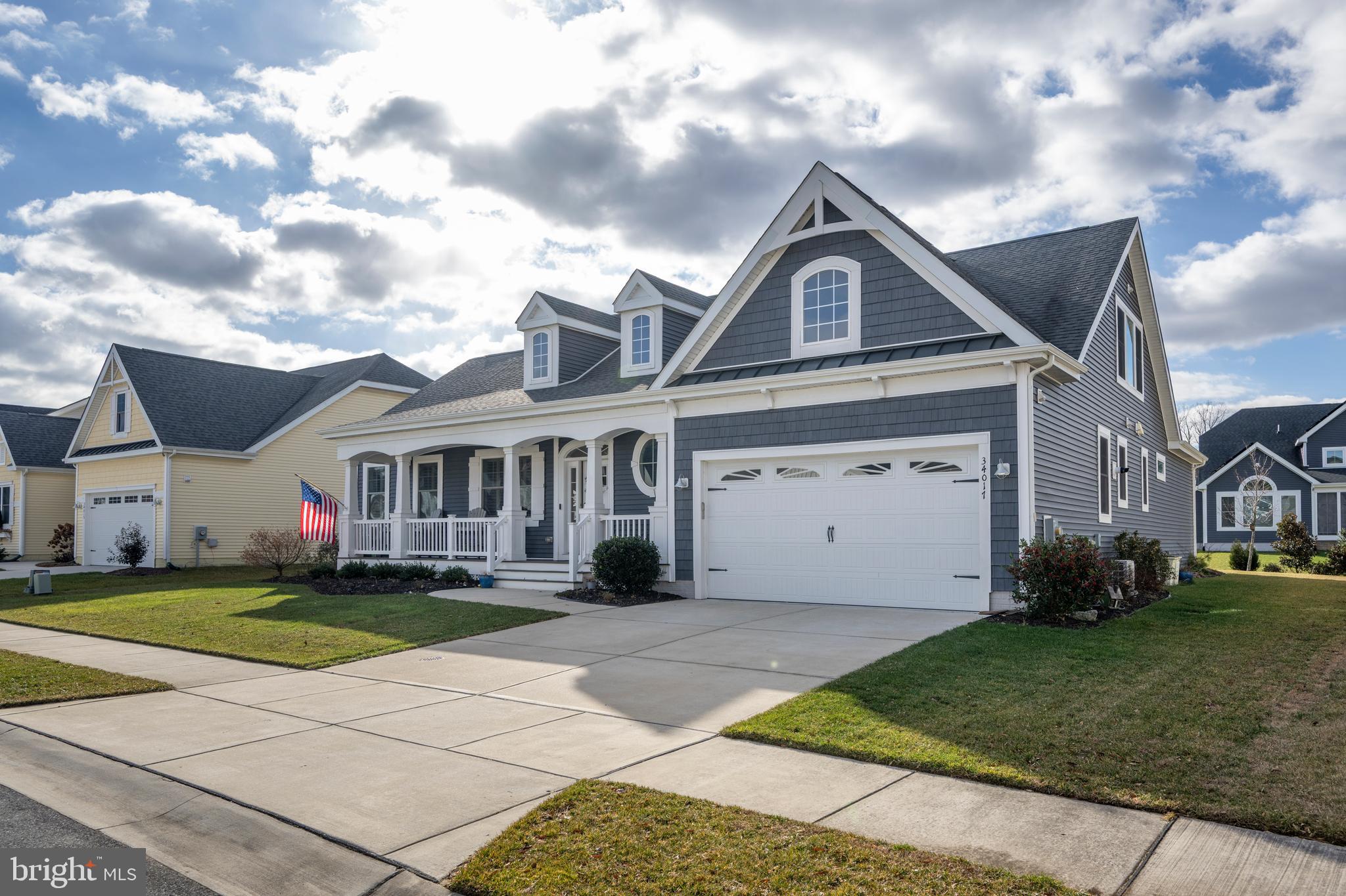 34017 Smiths Point Lane Lewes, DE 19958 - Photo 2 of 66 a view of a big house with a big yard and large trees