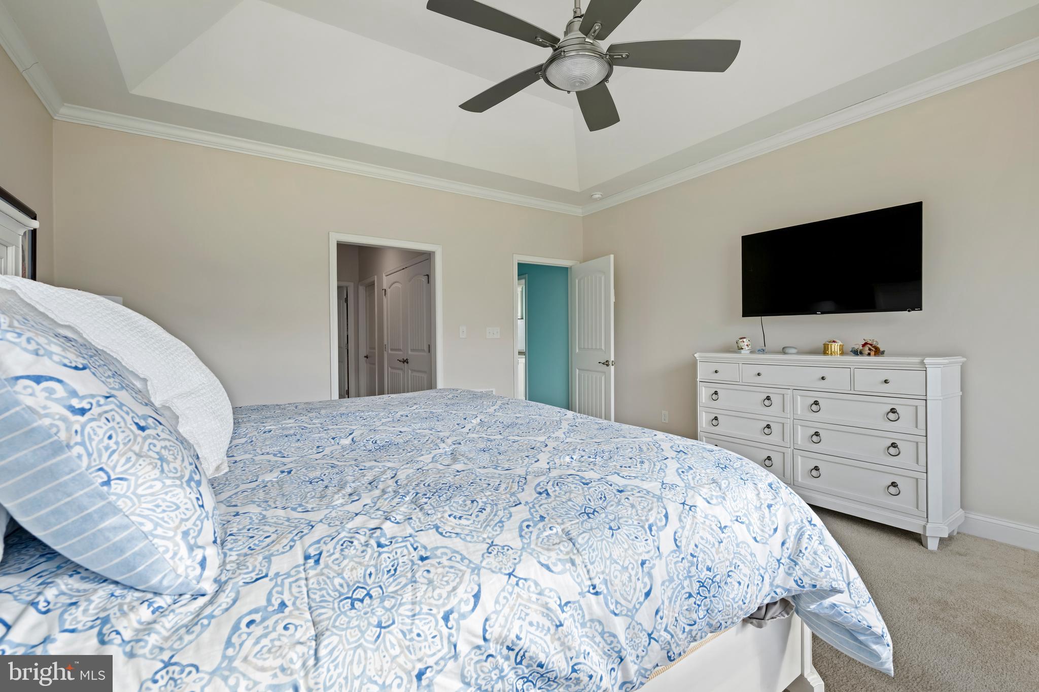 34017 Smiths Point Lane Lewes, DE 19958 - Photo 27 of 66 a bedroom with a bed and a flat screen tv