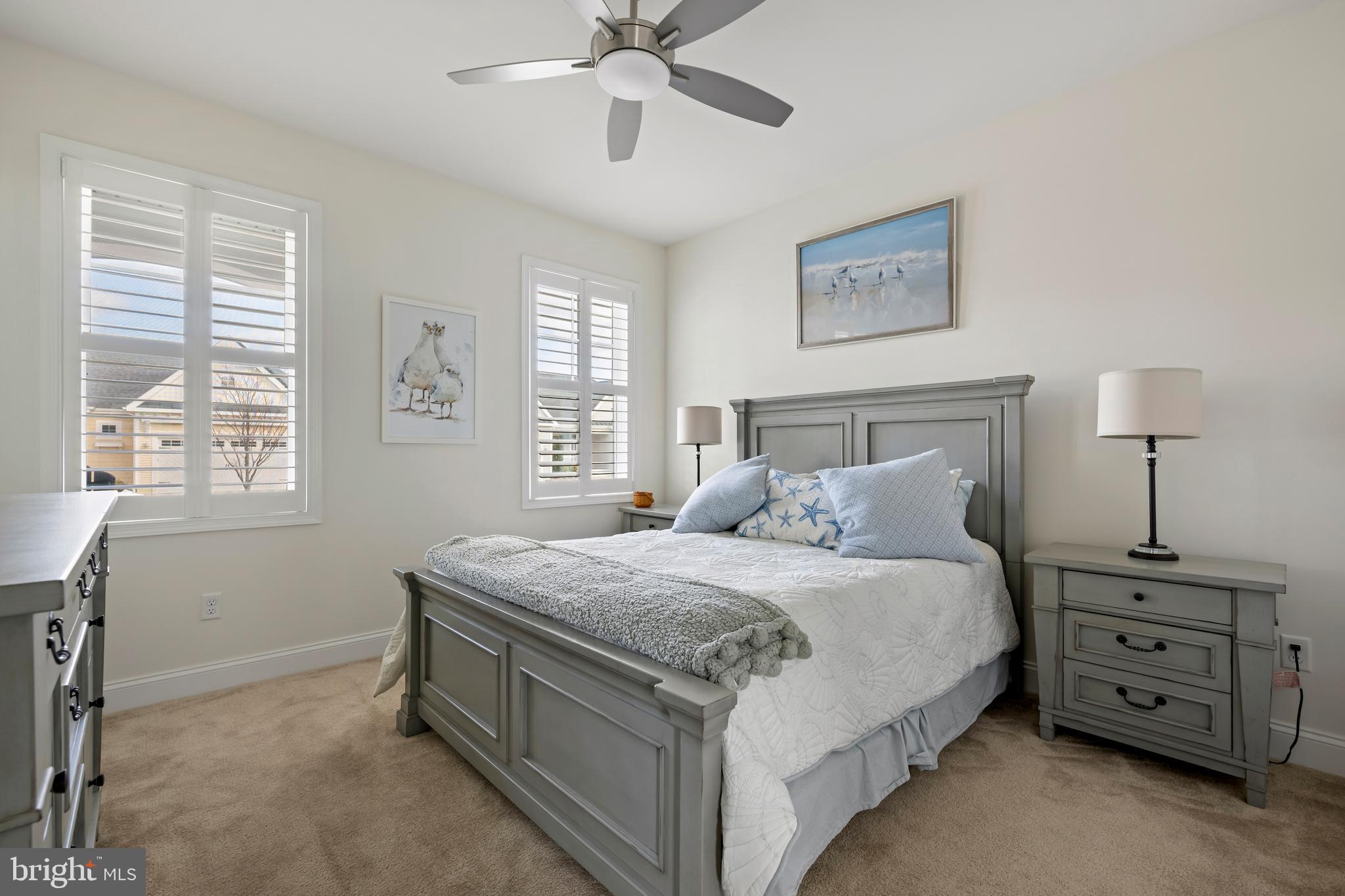 34017 Smiths Point Lane Lewes, DE 19958 - Photo 36 of 66 a bedroom with a bed and a window