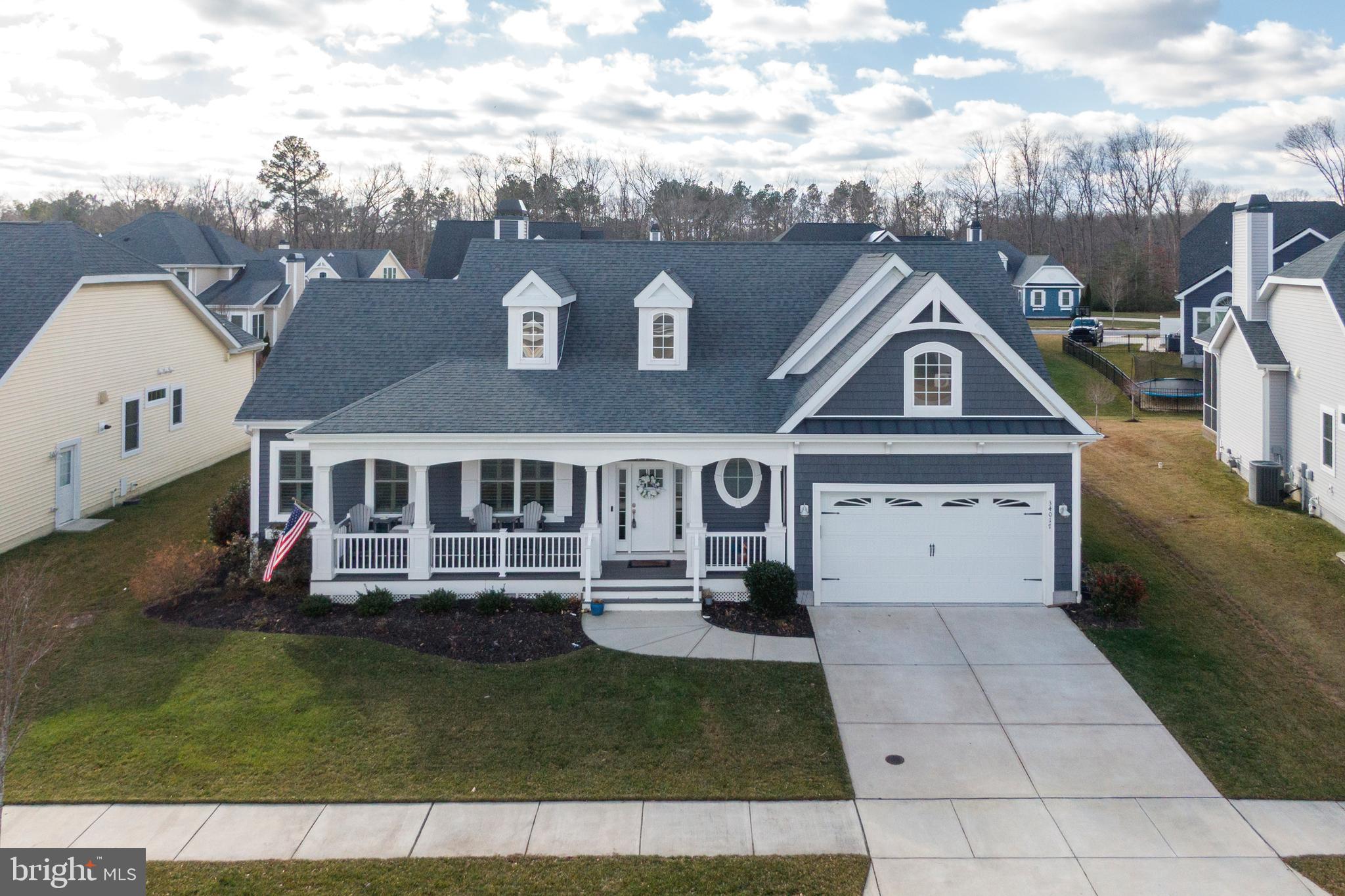 34017 Smiths Point Lane Lewes, DE 19958 - Photo 4 of 66 front view of a house with a yard