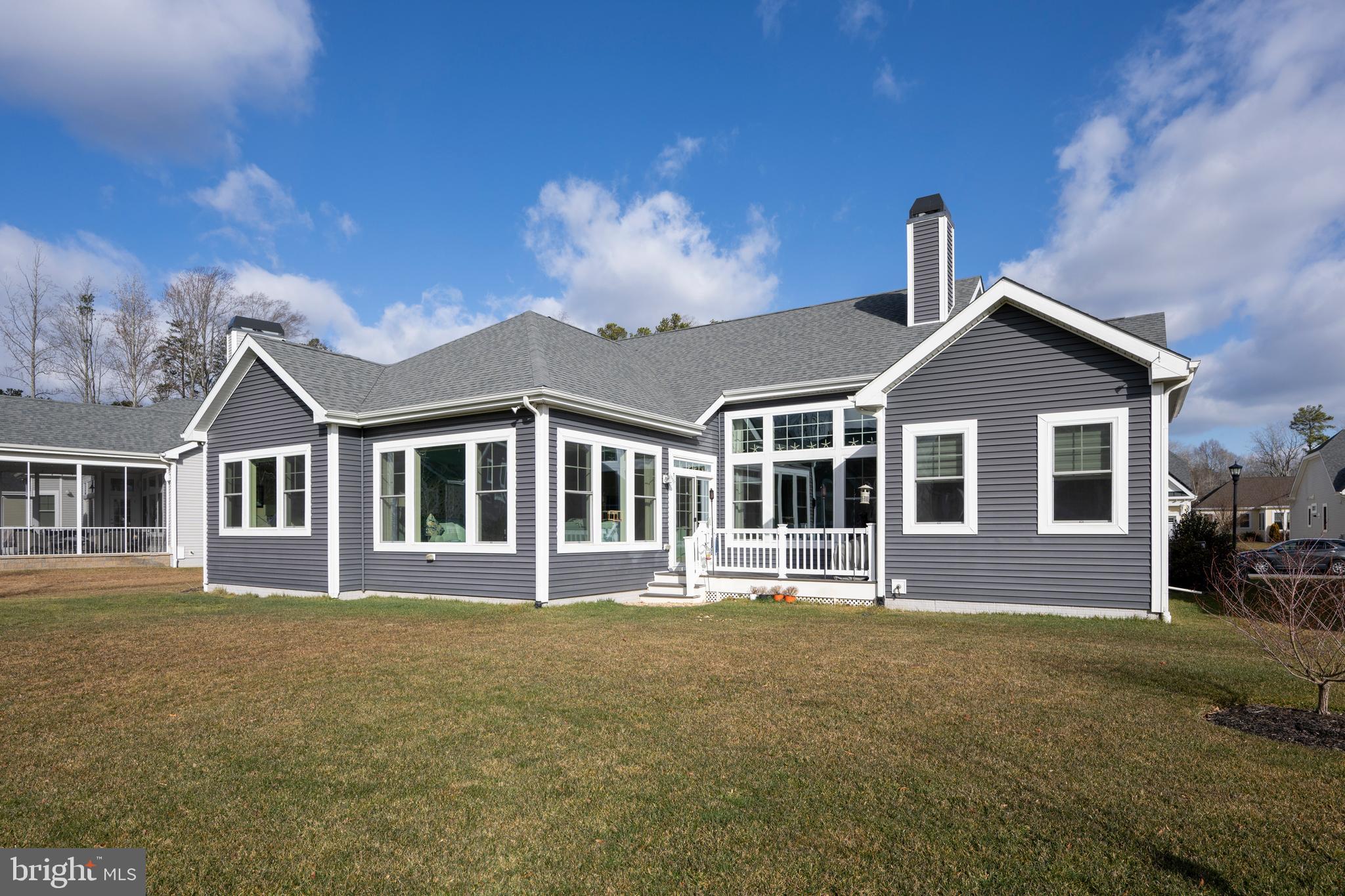 34017 Smiths Point Lane Lewes, DE 19958 - Photo 41 of 66 a front view of a house with a yard
