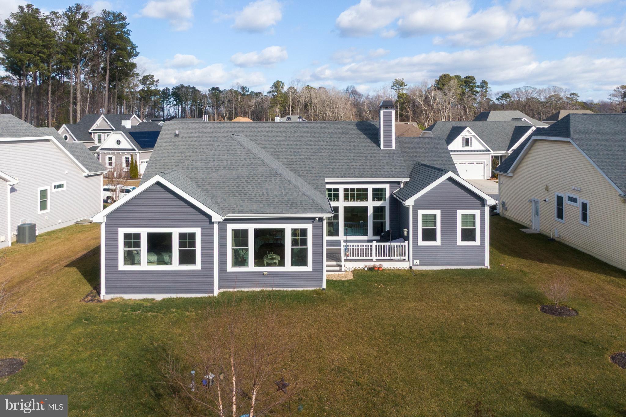 34017 Smiths Point Lane Lewes, DE 19958 - Photo 42 of 66 a front view of a house with a garden