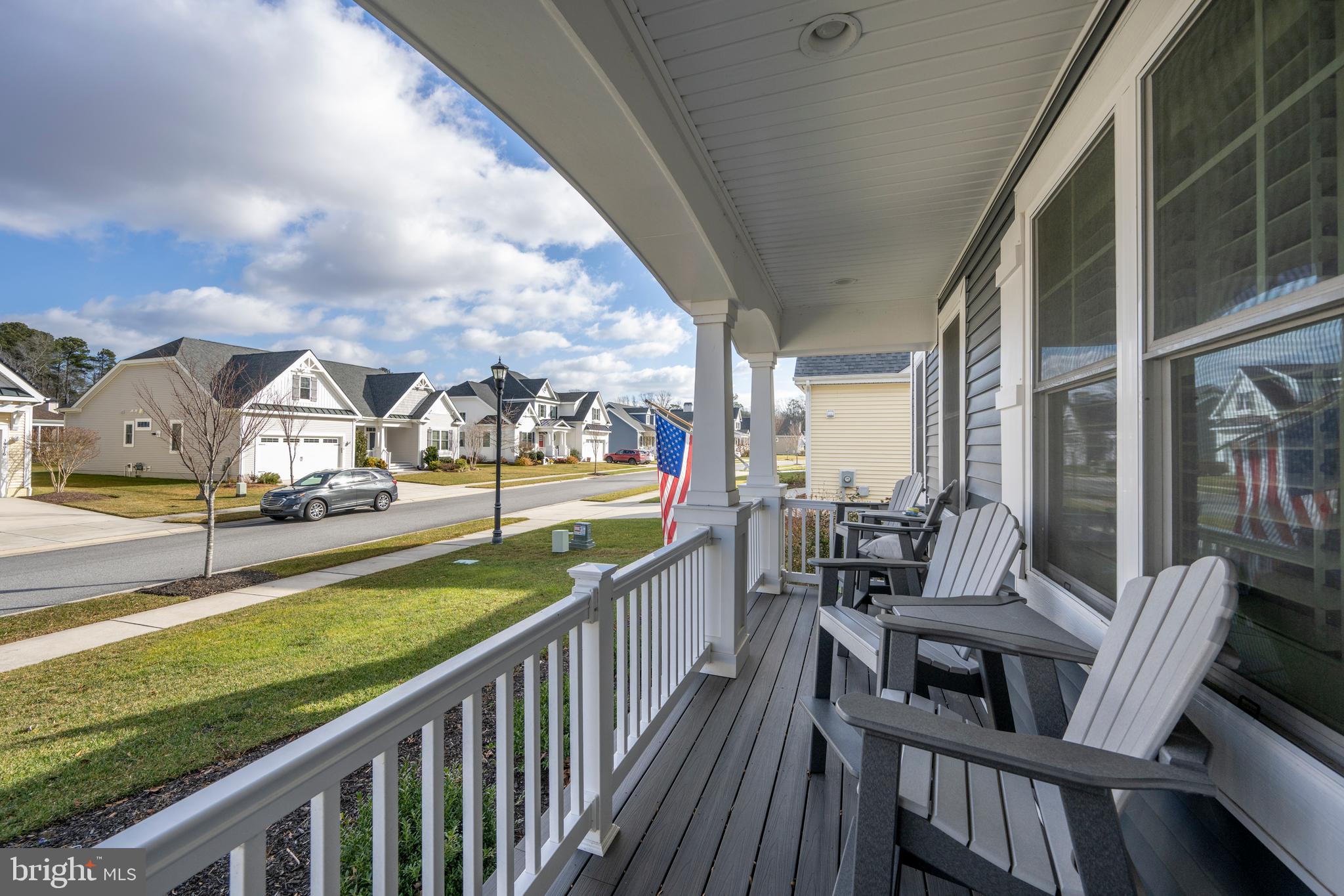 34017 Smiths Point Lane Lewes, DE 19958 - Photo 47 of 66 a view of a balcony with lake view and wooden floor