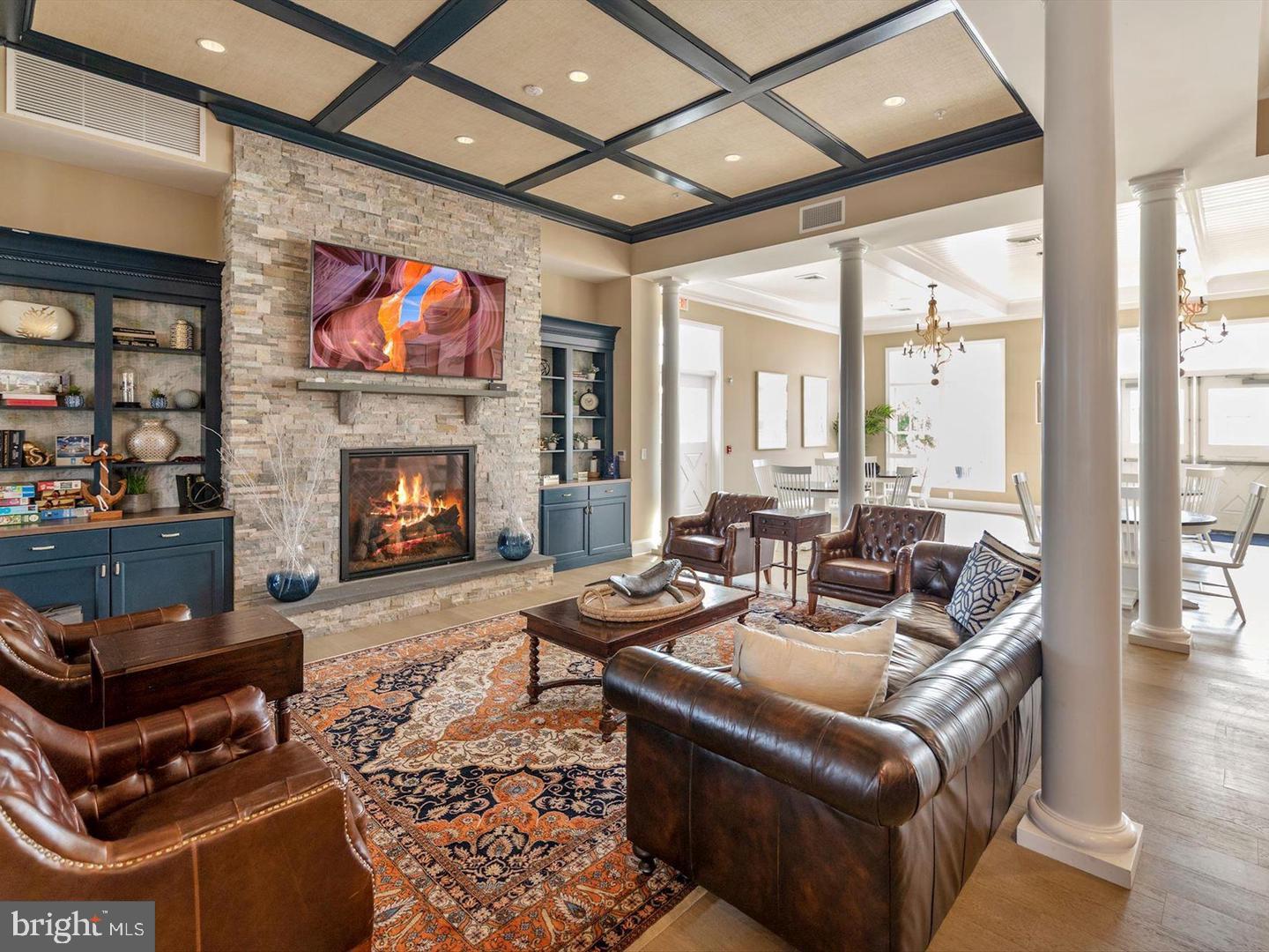 34017 Smiths Point Lane Lewes, DE 19958 - Photo 60 of 66 a living room with furniture a flat screen tv and a fireplace