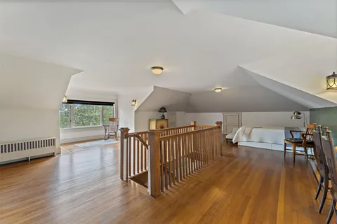 a view of a livingroom with furniture and hardwood floor