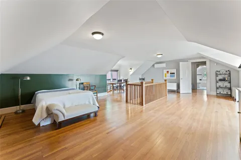 a bedroom with bed and a window