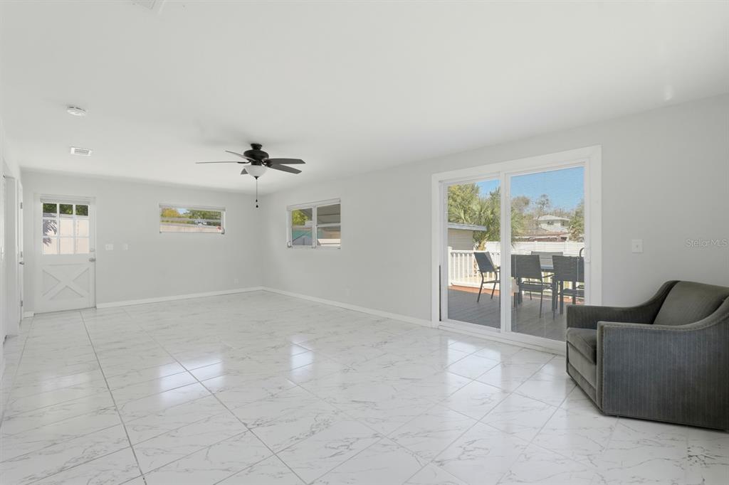 231 North Ridgewood Avenue Ormond Beach, FL 32174 - Photo 9 of 52 a view of an empty room with a window