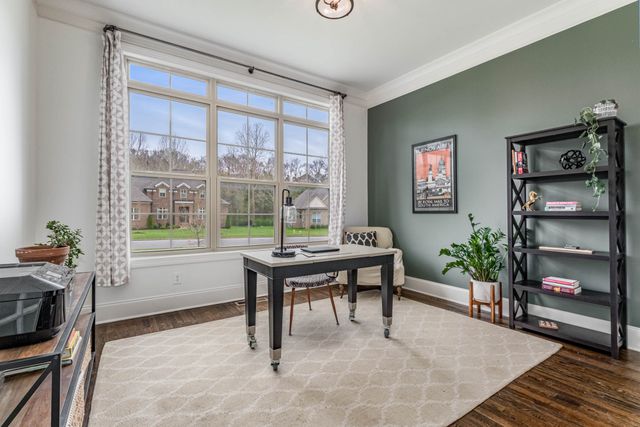a view of staircase with white walls and a window