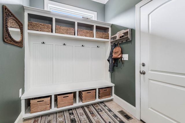 a bathroom with a sink mirror and toilet