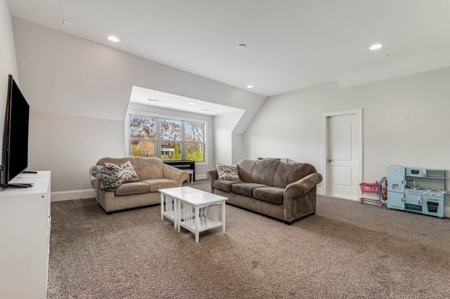 a backyard of a house with outdoor seating