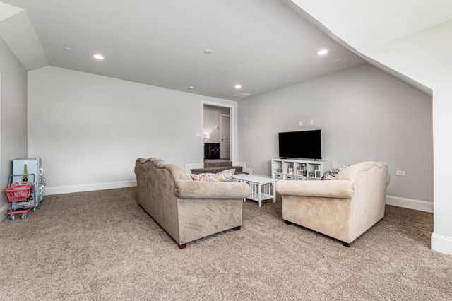 a swimming pool with outdoor seating and yard
