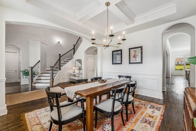 a view of a dining room with furniture and window
