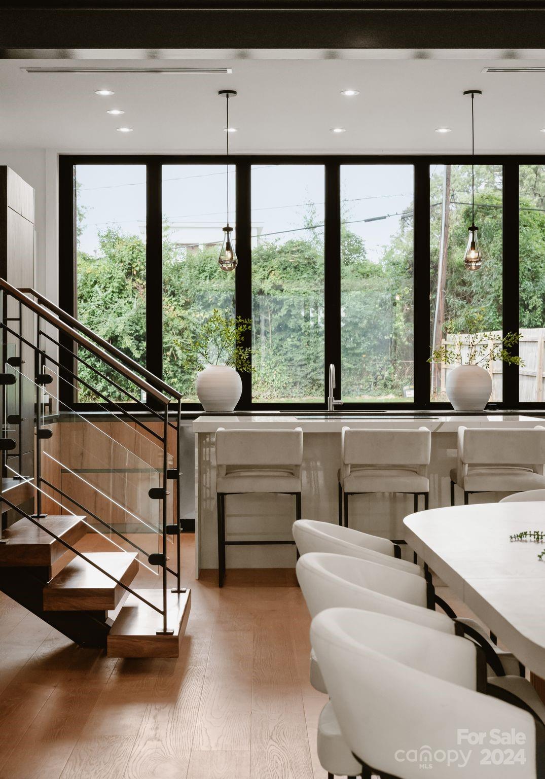237 Marsh Road, Unit 101 Charlotte, NC 28209 - Photo 14 of 48 a living room with furniture and large windows