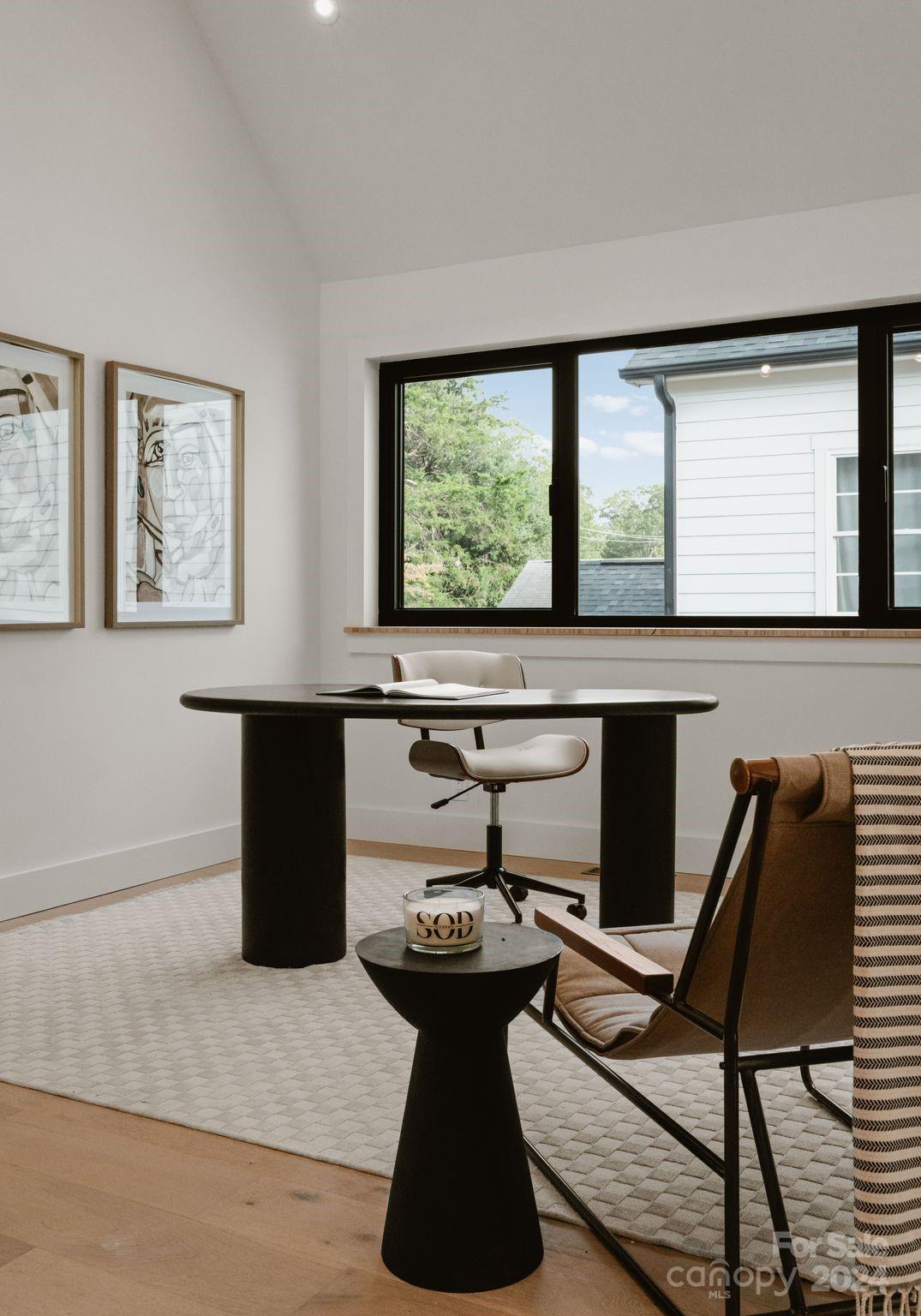 237 Marsh Road, Unit 101 Charlotte, NC 28209 - Photo 20 of 48 a kitchen with a table chairs in it and wooden floors