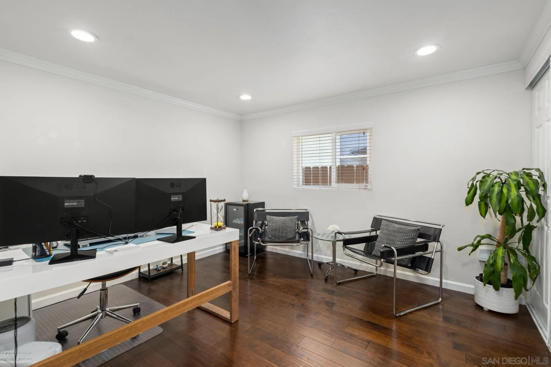 346 El Monte Road El Cajon, CA 92020 - Photo 13 of 24 a view of a workspace with furniture and wooden floor
